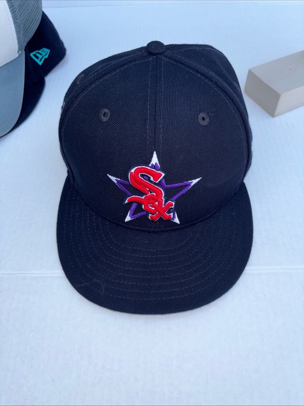 New Era Black Snapback Hat with Red & Purple Logo